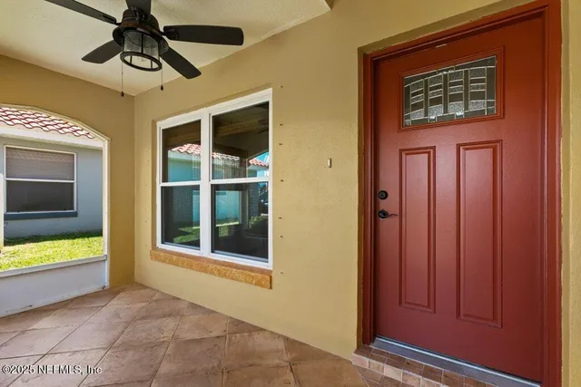 a kitchen with stainless steel appliances kitchen island granite countertop a stove and a view of living room