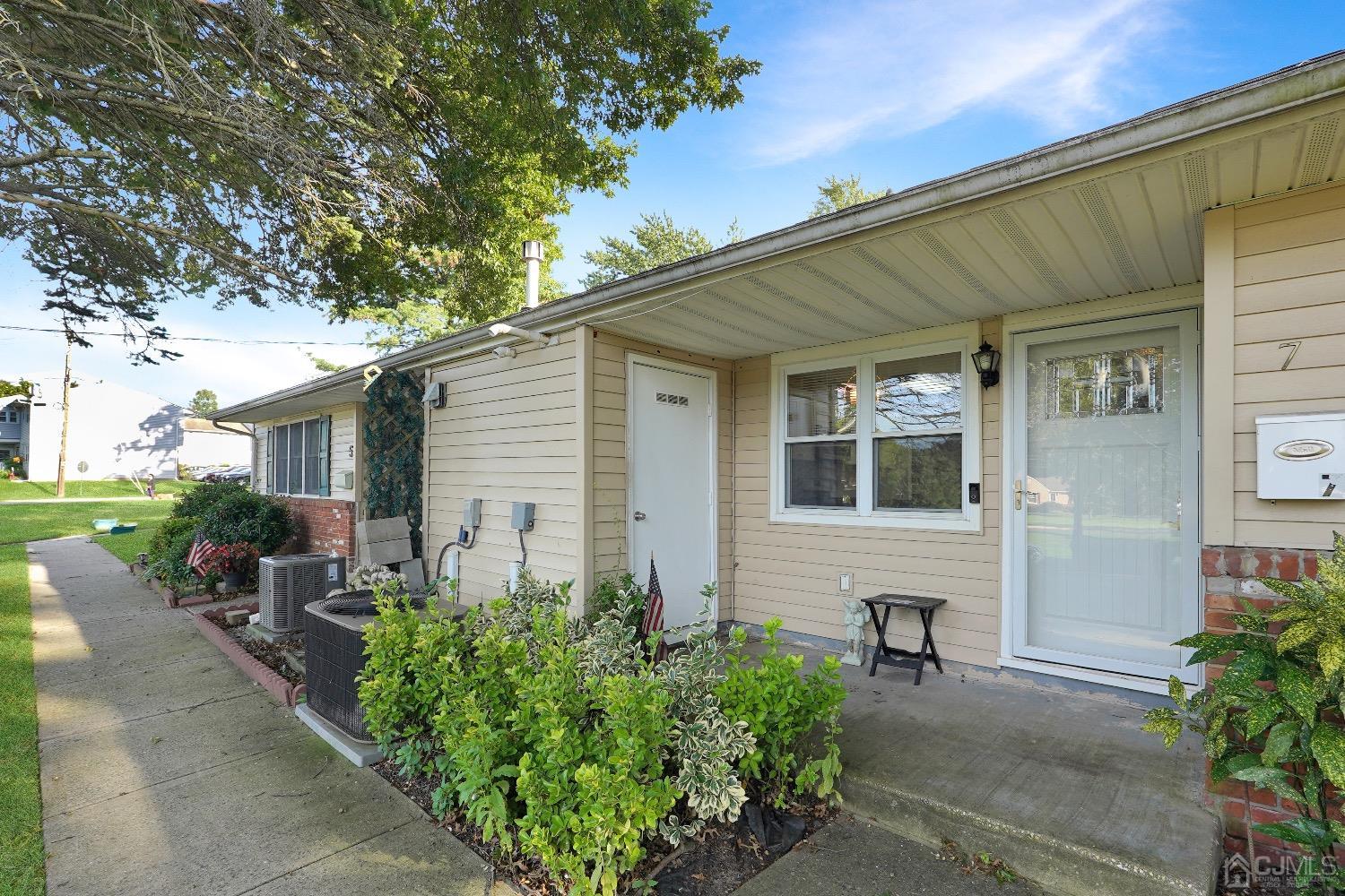 a backyard of a house with outdoor seating