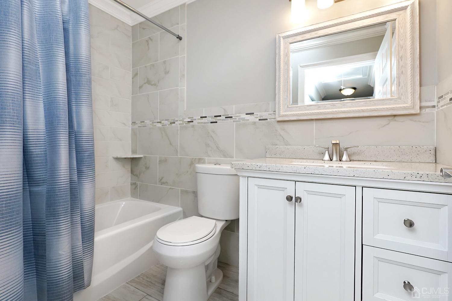7 Haven Drive Old Bridge, NJ 07747 - Photo 18 of 24 a bathroom with a sink a toilet and shower