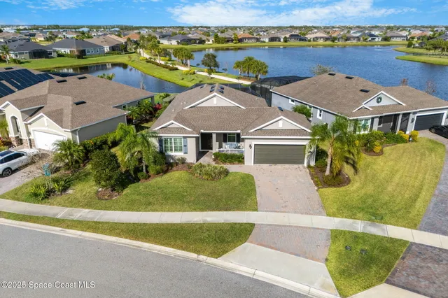 an aerial view of a house with a garden