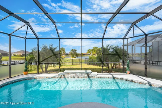 a view of a swimming pool with an outdoor seating