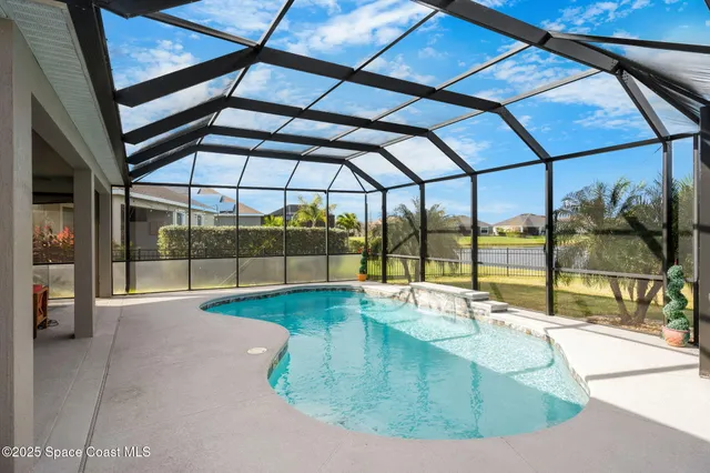 a view of a pool patio and lake view