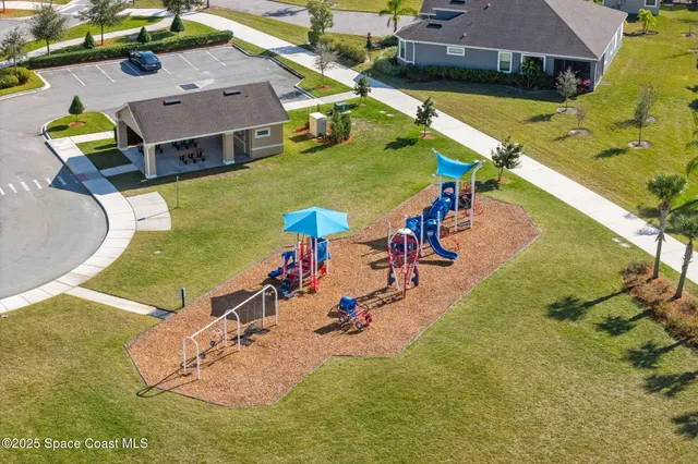 an aerial view of a pool patio swimming pool and outdoor seating