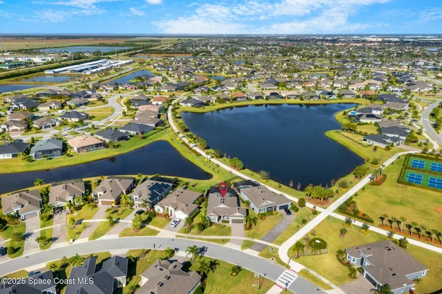 an aerial view of residential houses and outdoor space