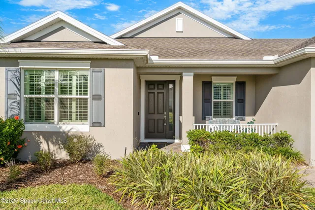 a view of a hallway with furniture