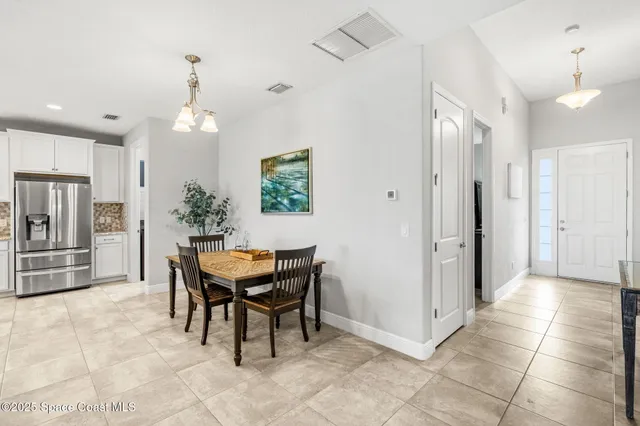 a view of a dining room with furniture