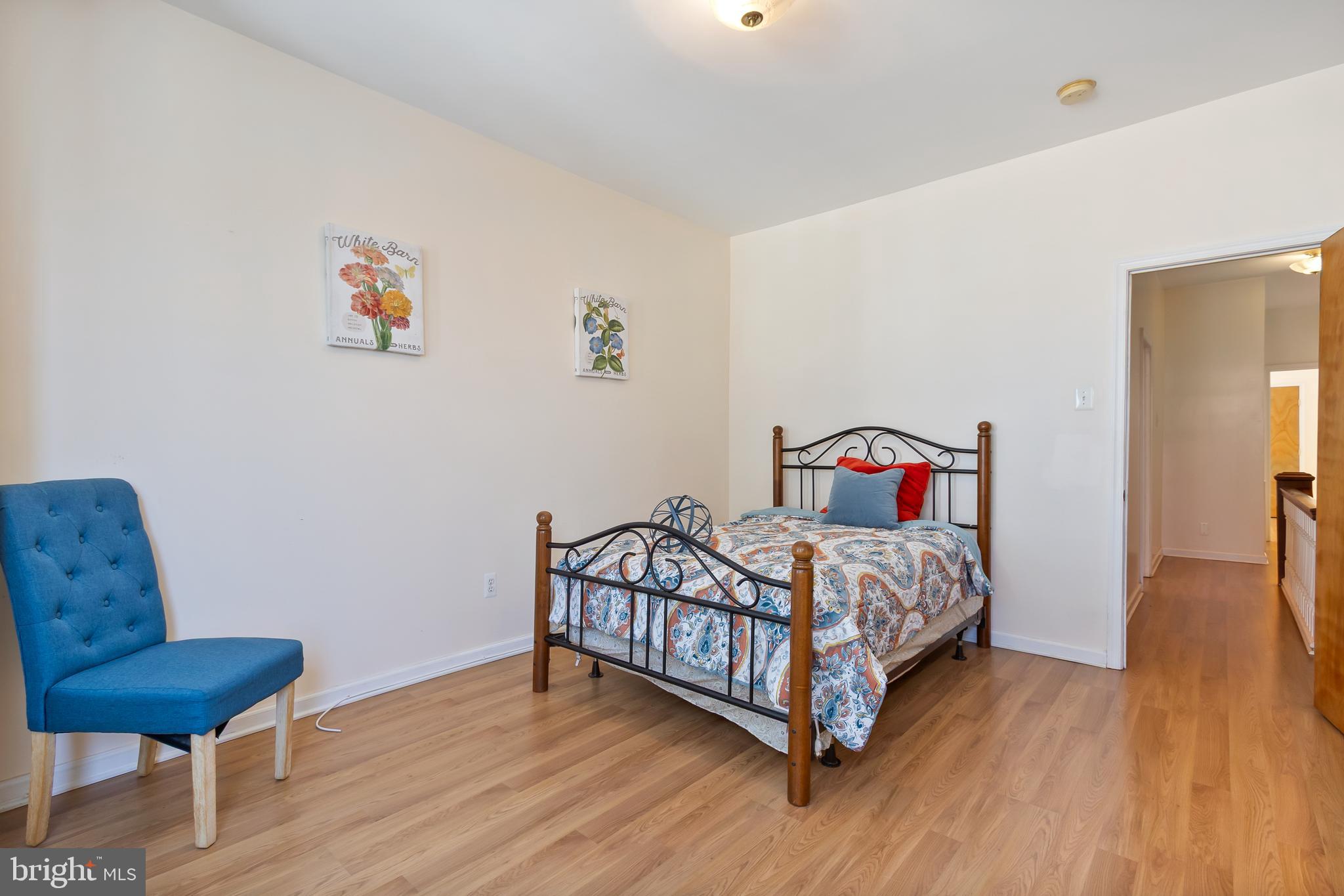 934 North Fourth Street Camden, NJ 08102 - Photo 17 of 34 a bedroom with a bed and wooden floor