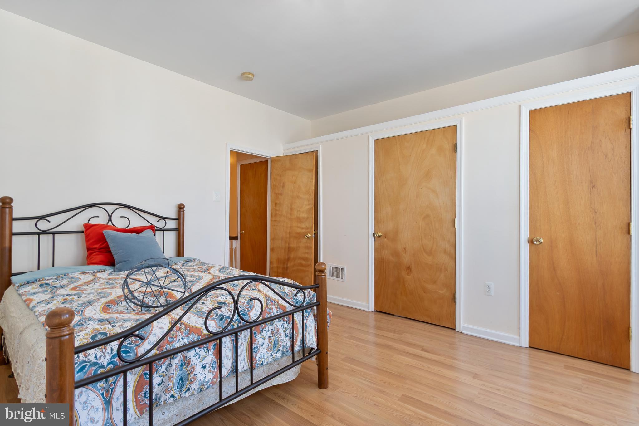 934 North Fourth Street Camden, NJ 08102 - Photo 18 of 34 a bedroom with a bed with wooden floor