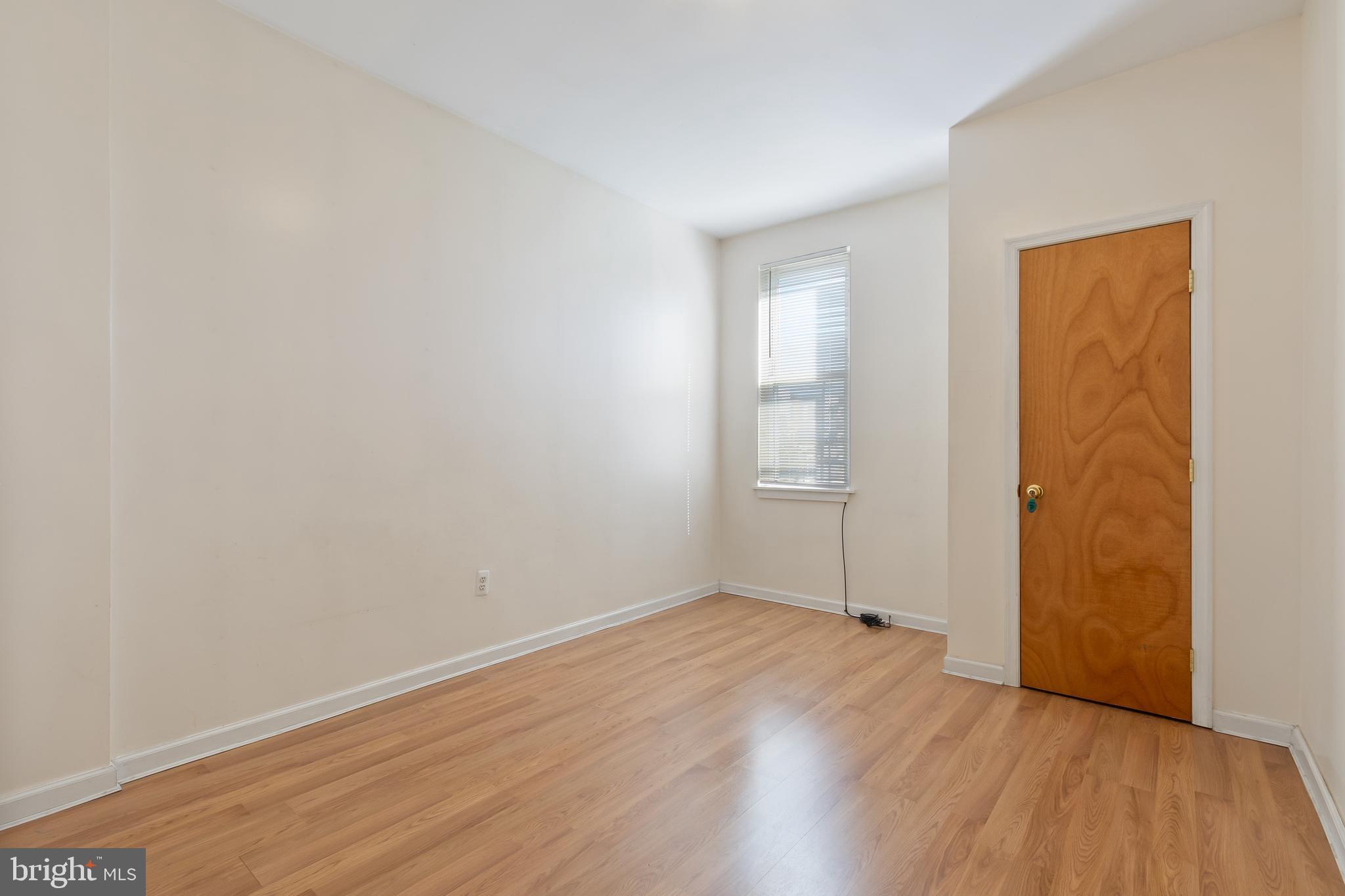 934 North Fourth Street Camden, NJ 08102 - Photo 24 of 34 an empty room with wooden floor and windows
