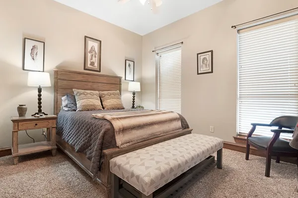 a bedroom with a bed and chair