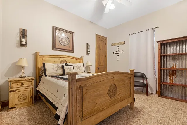 a bedroom with a bed and a book shelf