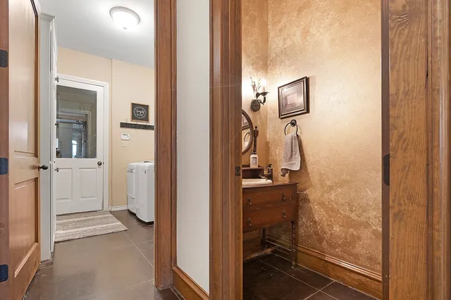 a view of a bathroom from a hallway