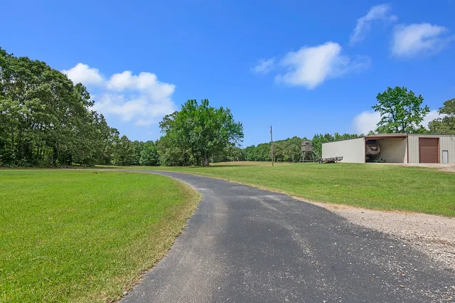 a view of a house with a big yard