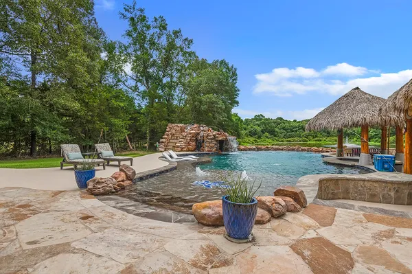 a view of a backyard with sitting area