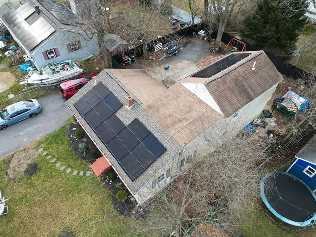 a view of residential houses and car parked