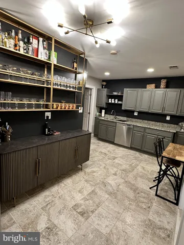 a kitchen with stainless steel appliances granite countertop a cabinets