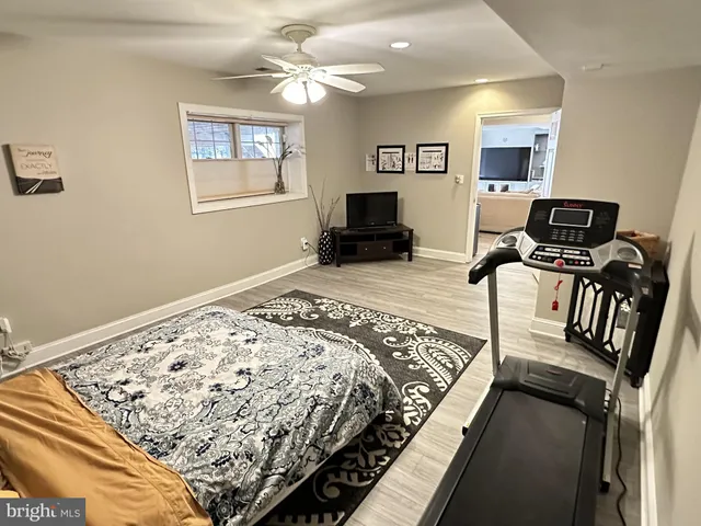 a bedroom with bed window and furniture