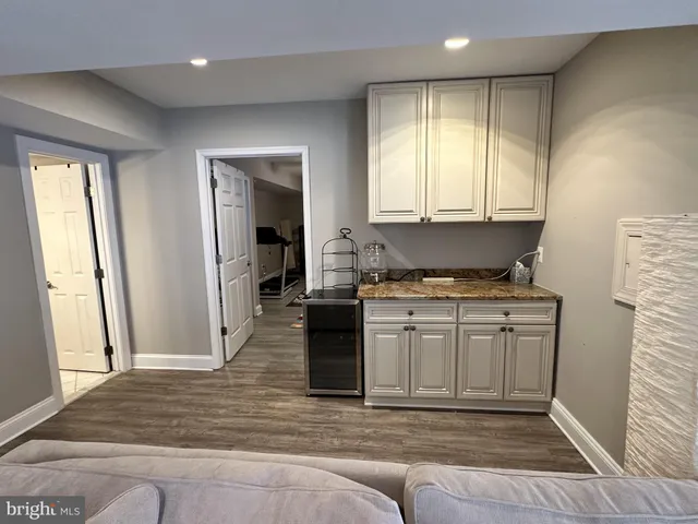 a kitchen with a refrigerator and window