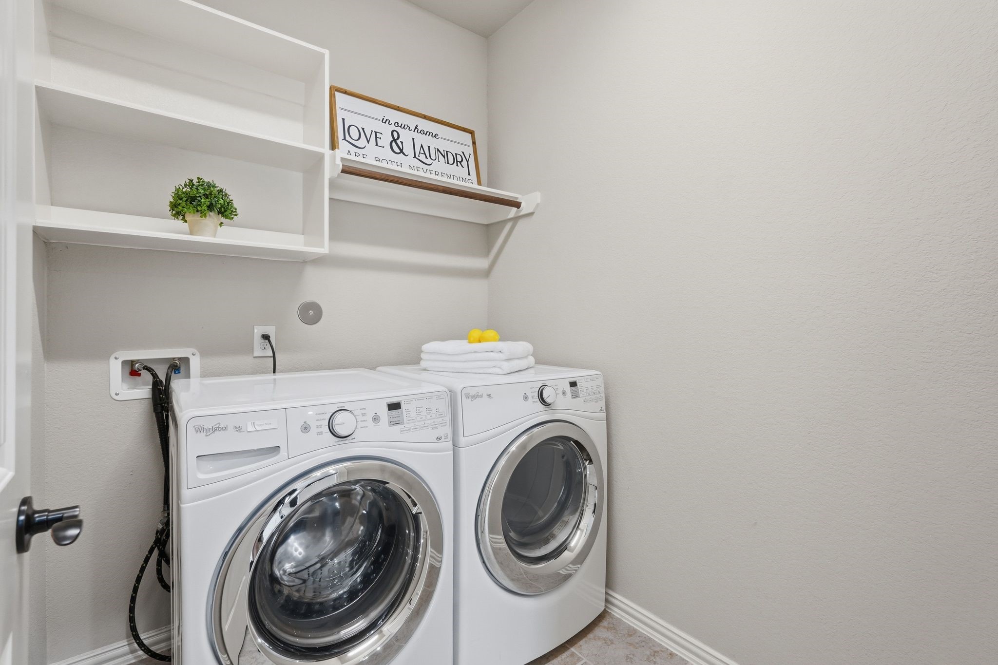 18227 Tacoma Ridge Drive Tomball, TX 77377 - Photo 33 of 45 Functional utility room with built-in shelving for added storage and organization.