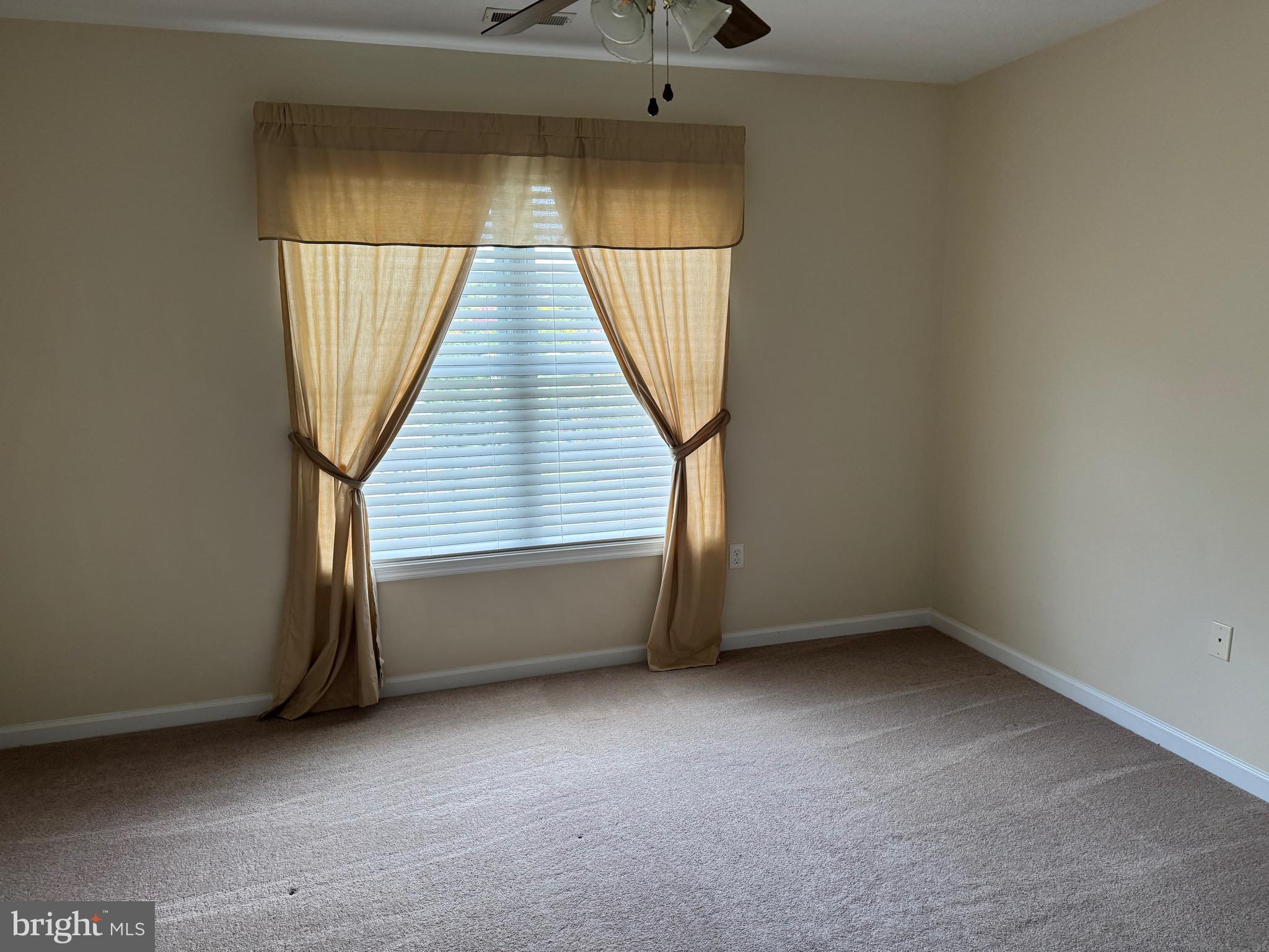 115 Gloucester Road Front Royal, VA 22630 - Photo 12 of 14 an empty room with wooden floor and windows