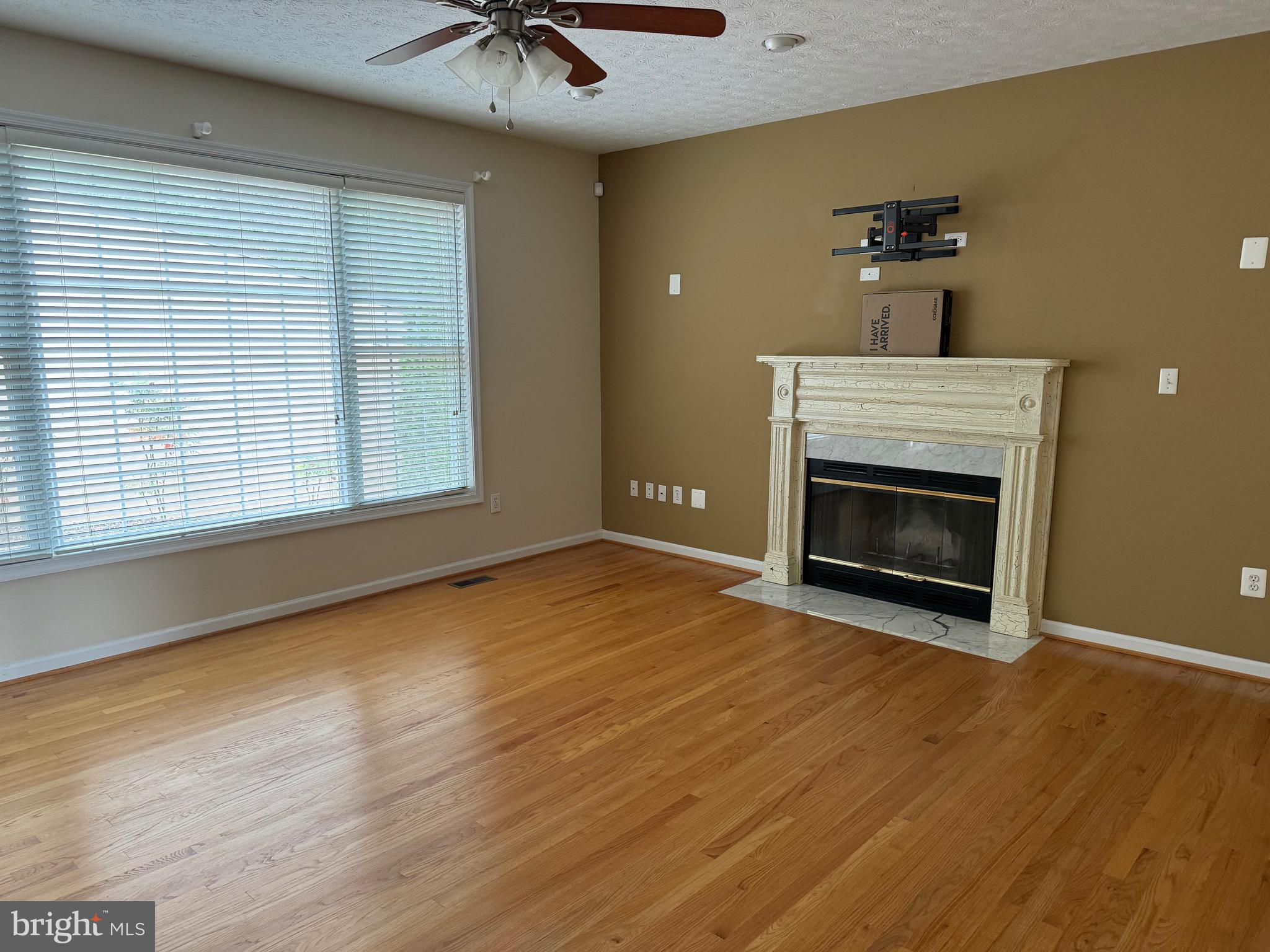 115 Gloucester Road Front Royal, VA 22630 - Photo 5 of 14 a view of an empty room with a fireplace and a window