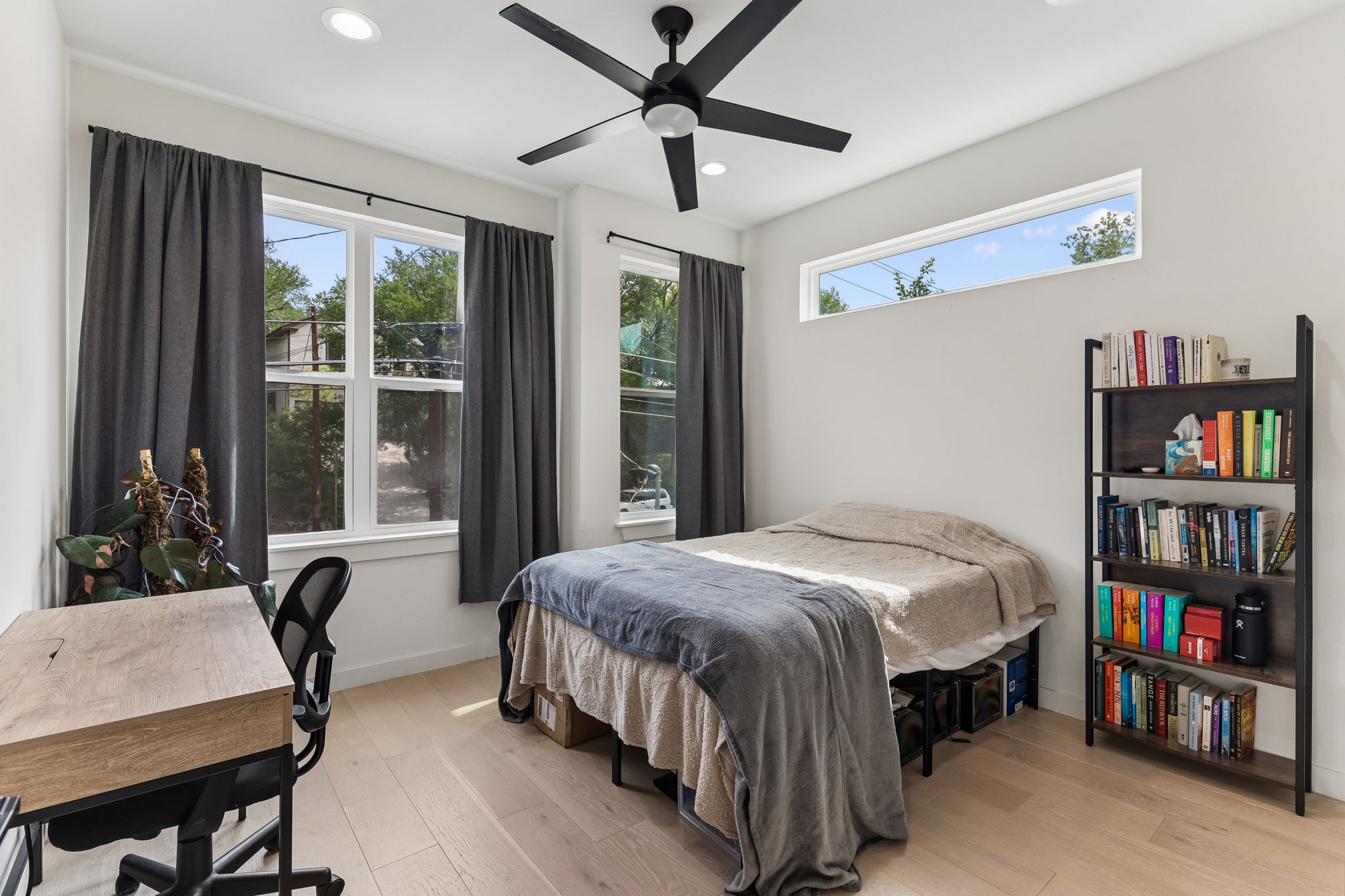 5305 Ledesma Road, Unit 1 Austin, TX 78721 - Photo 17 of 26 Light wood-finish flooring complements the white walls and ceiling