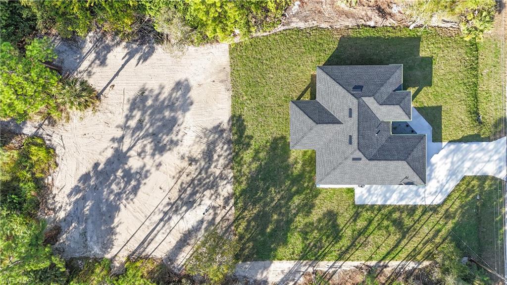 809 Williams Avenue Lehigh Acres, FL 33972 - Photo 30 of 33 an aerial view of residential houses with outdoor space