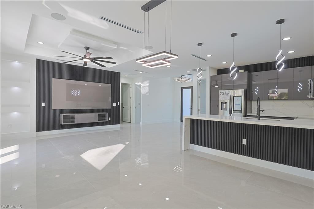 809 Williams Avenue Lehigh Acres, FL 33972 - Photo 33 of 33 a view of a living room a flat screen tv