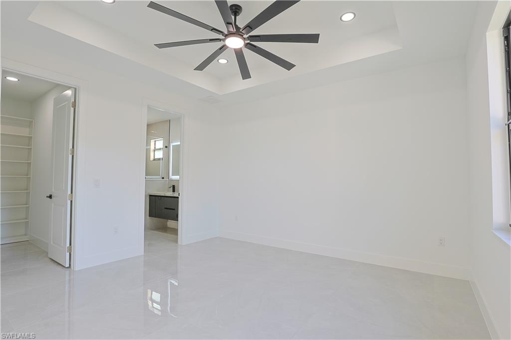 809 Williams Avenue Lehigh Acres, FL 33972 - Photo 8 of 33 an empty room with closet and windows