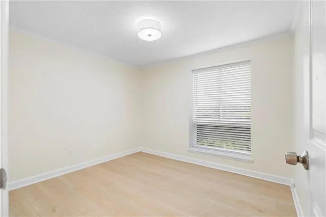 a bathroom with a bathtub shower sink vanity mirror and toilet