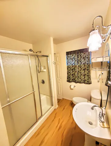 a bathroom with a glass shower door