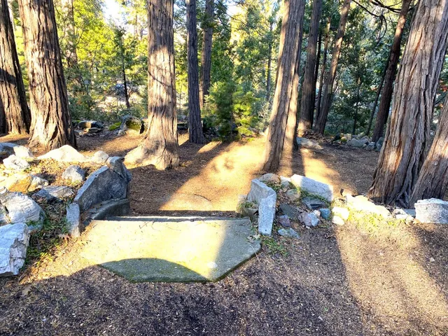 a view of a street with wooden fence