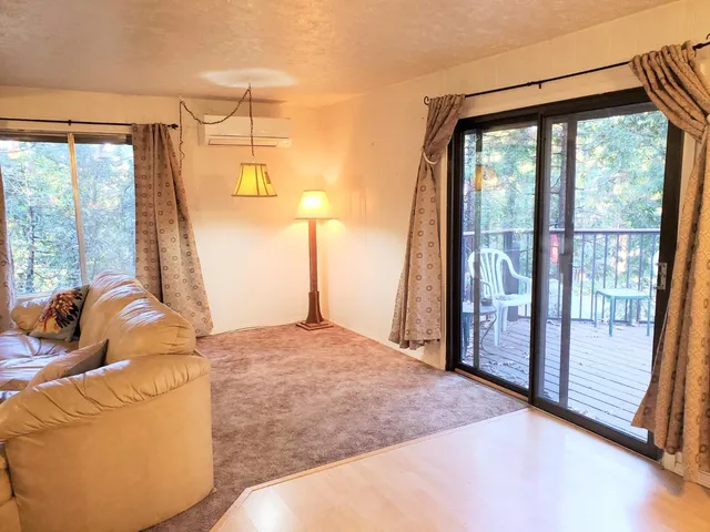 a bed room with a bed and wooden floor