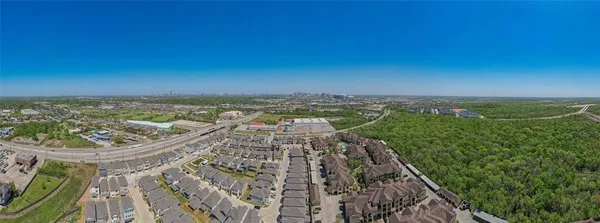 an aerial view of a house with a lake view