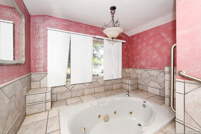 a bathroom with a bathtub and shower