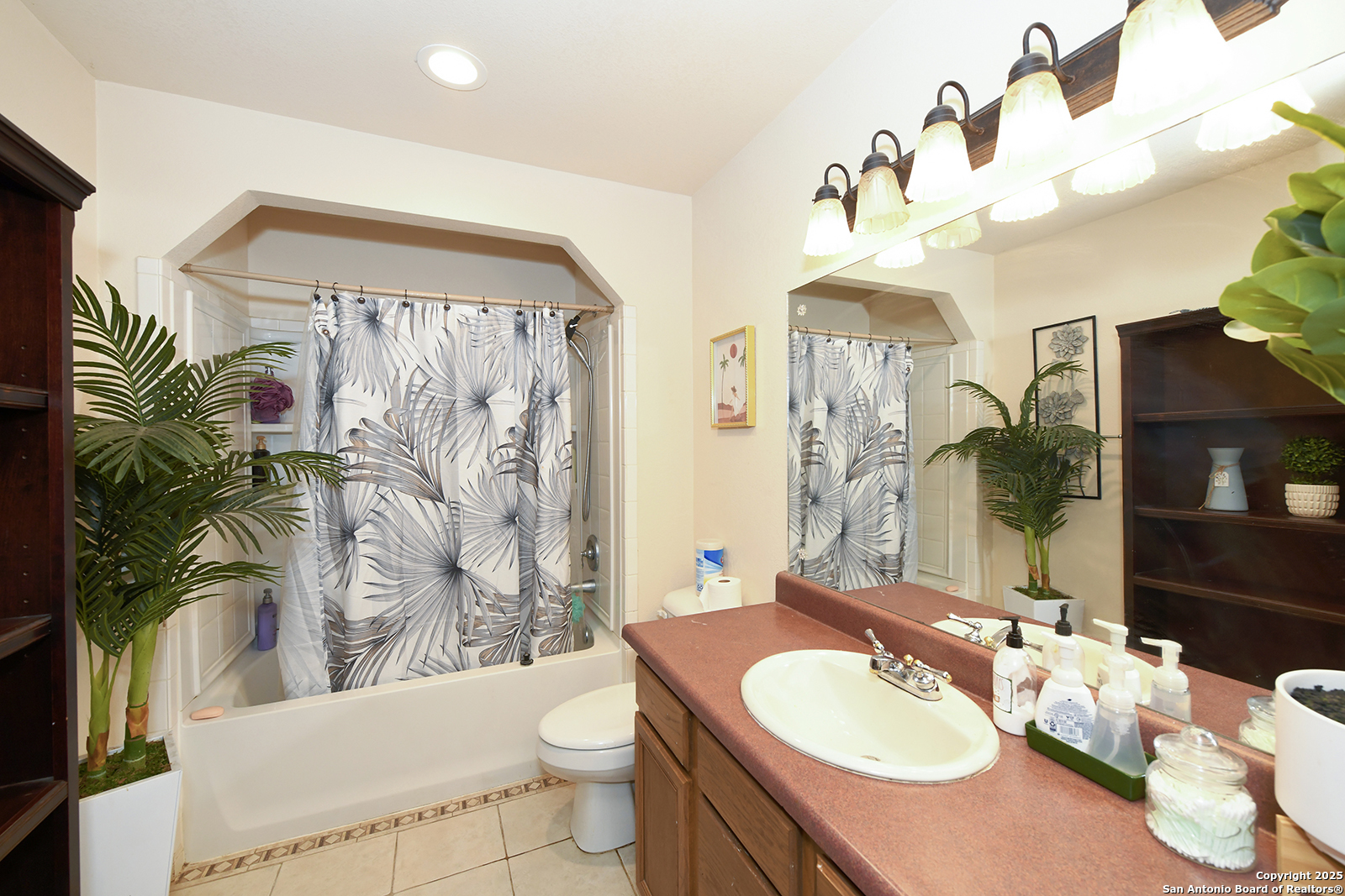 4720 Rakowitz Road Adkins, TX 78101 - Photo 18 of 35 a bathroom with a sink vanity mirror and toilet