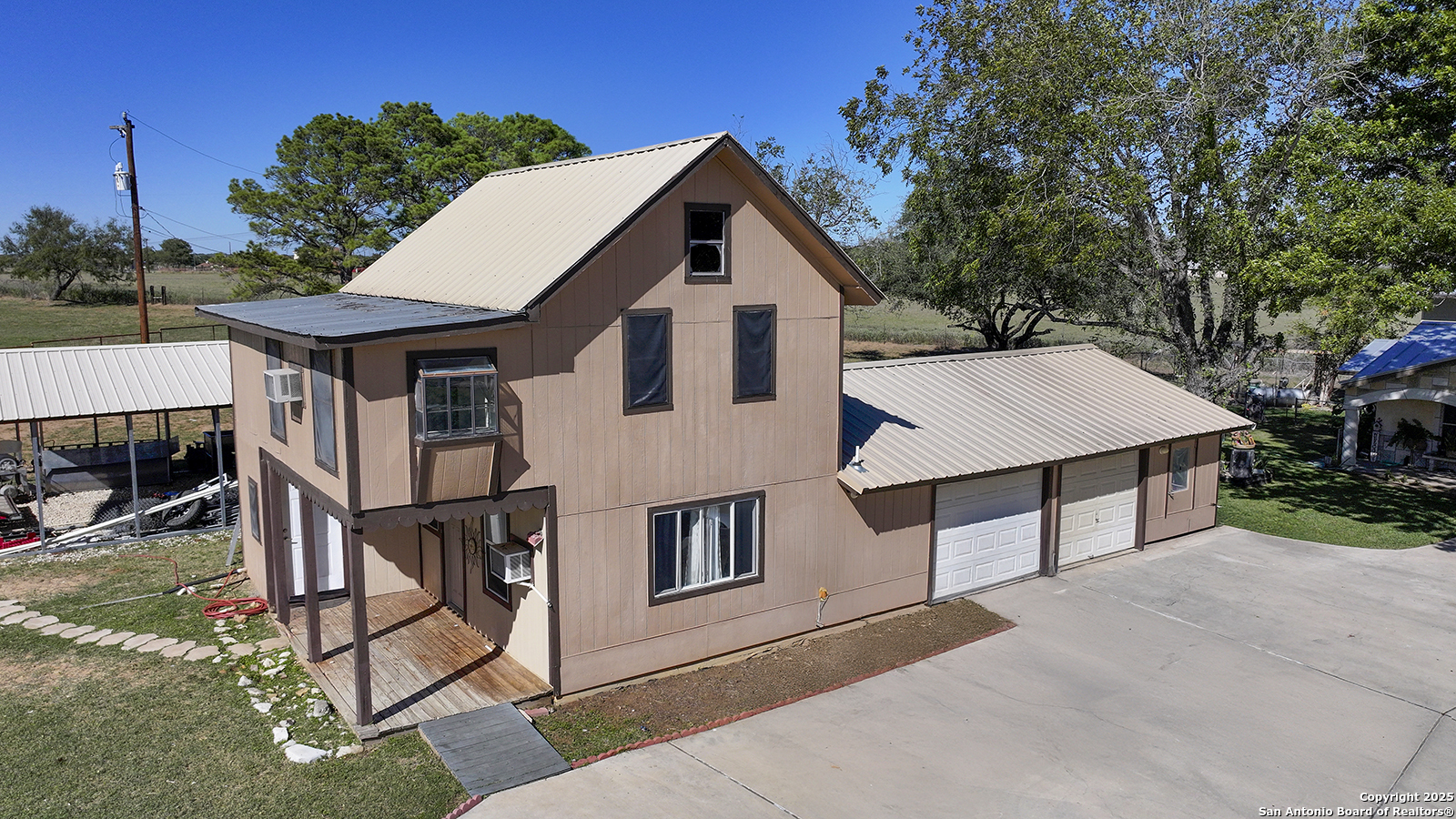 4720 Rakowitz Road Adkins, TX 78101 - Photo 23 of 35 a aerial view of a house with a yard and balcony