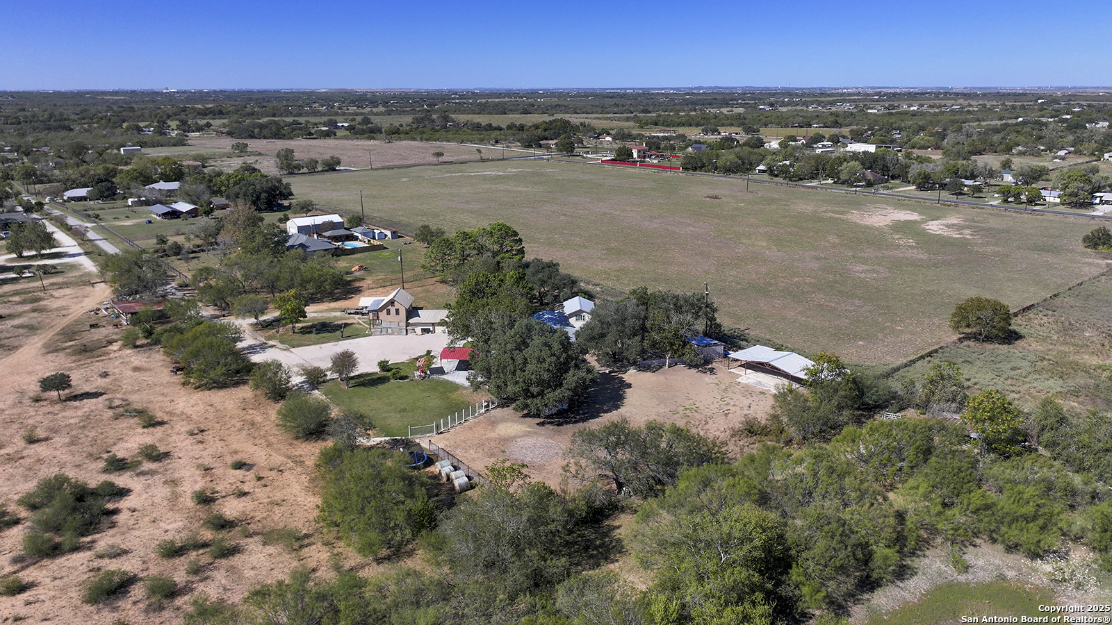 4720 Rakowitz Road Adkins, TX 78101 - Photo 3 of 35 an aerial view of a houses with a lake