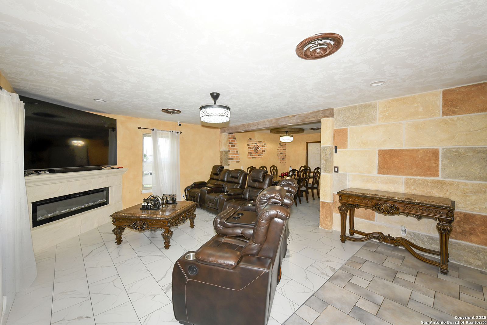 4720 Rakowitz Road Adkins, TX 78101 - Photo 8 of 35 a living room with furniture and a flat screen tv