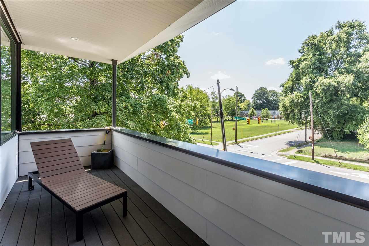 567 New Bern Avenue Raleigh, NC 27601 - Photo 22 of 30 a view of sitting area with furniture and wooden deck