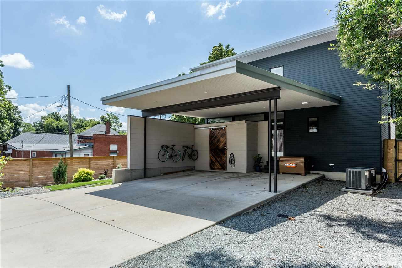 567 New Bern Avenue Raleigh, NC 27601 - Photo 23 of 30 a view of a patio with table and chairs under an umbrella