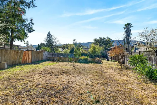 a backyard of a house with lots of green space