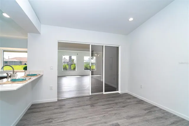 a view of a dining room with furniture window and outside view