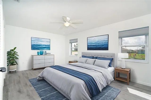 a bedroom with a large bed and a window