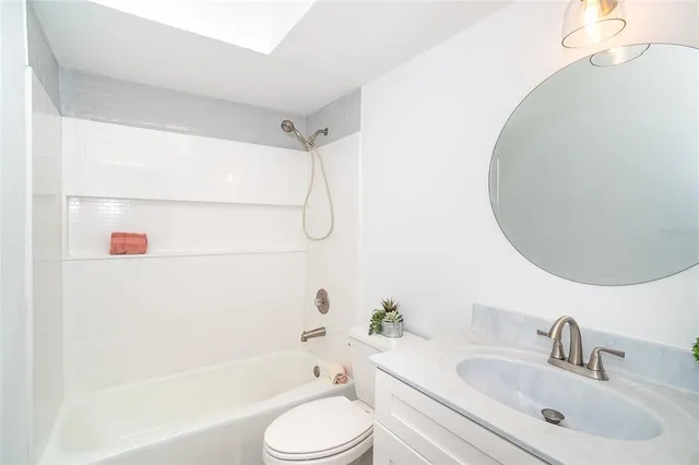 an aerial view of residential houses with outdoor space and river