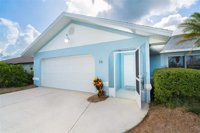 a potted plant sitting in front of a house