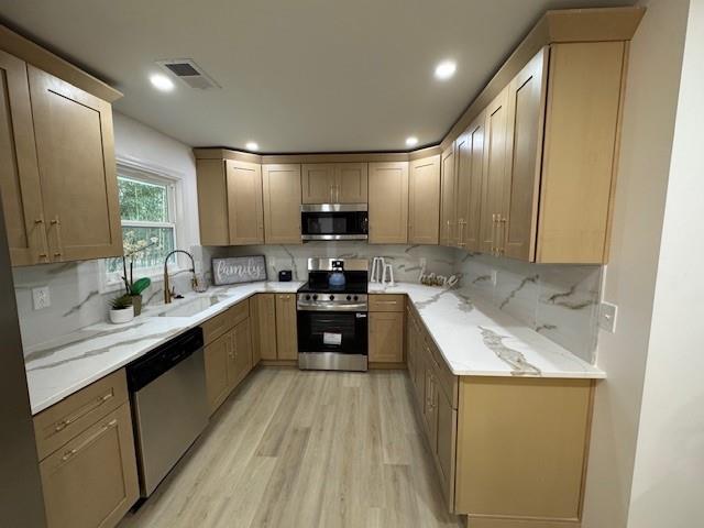 3130 Cadiz Circle Atlanta, GA 30349 - Photo 12 of 35 a large kitchen with a sink and cabinets