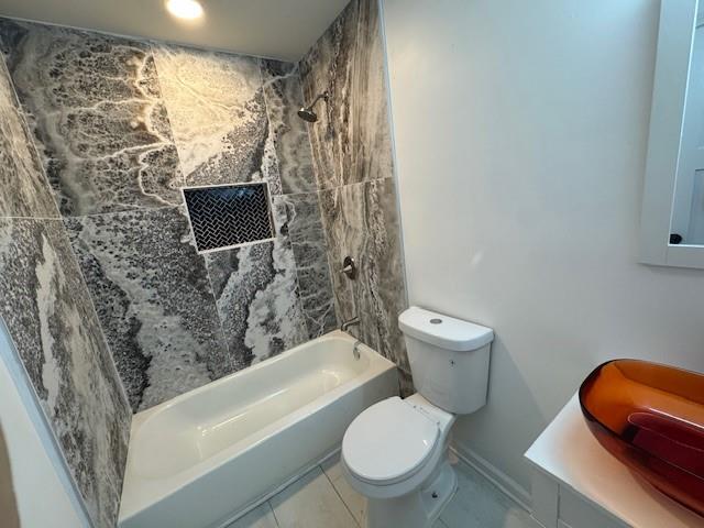 3130 Cadiz Circle Atlanta, GA 30349 - Photo 17 of 35 a bathroom with a toilet and a bathtub