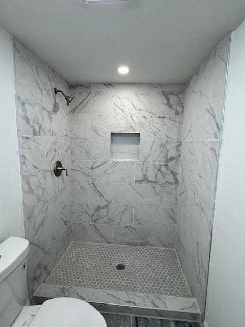 3130 Cadiz Circle Atlanta, GA 30349 - Photo 23 of 35 a bathroom with a toilet and a shower