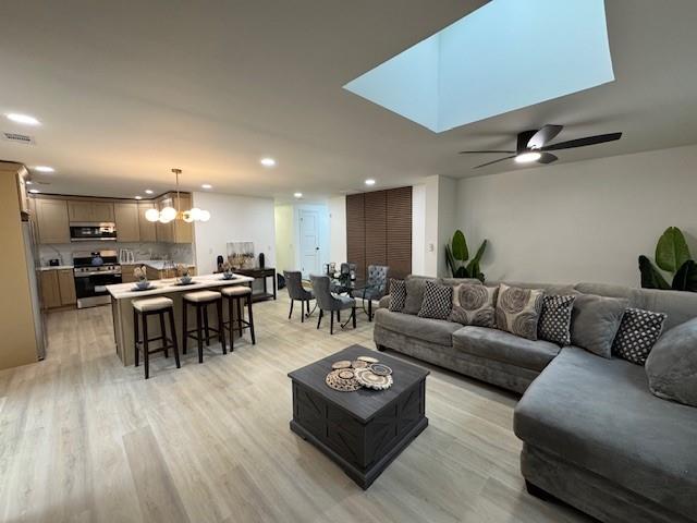 3130 Cadiz Circle Atlanta, GA 30349 - Photo 5 of 35 a living room with furniture kitchen view and a wooden floor